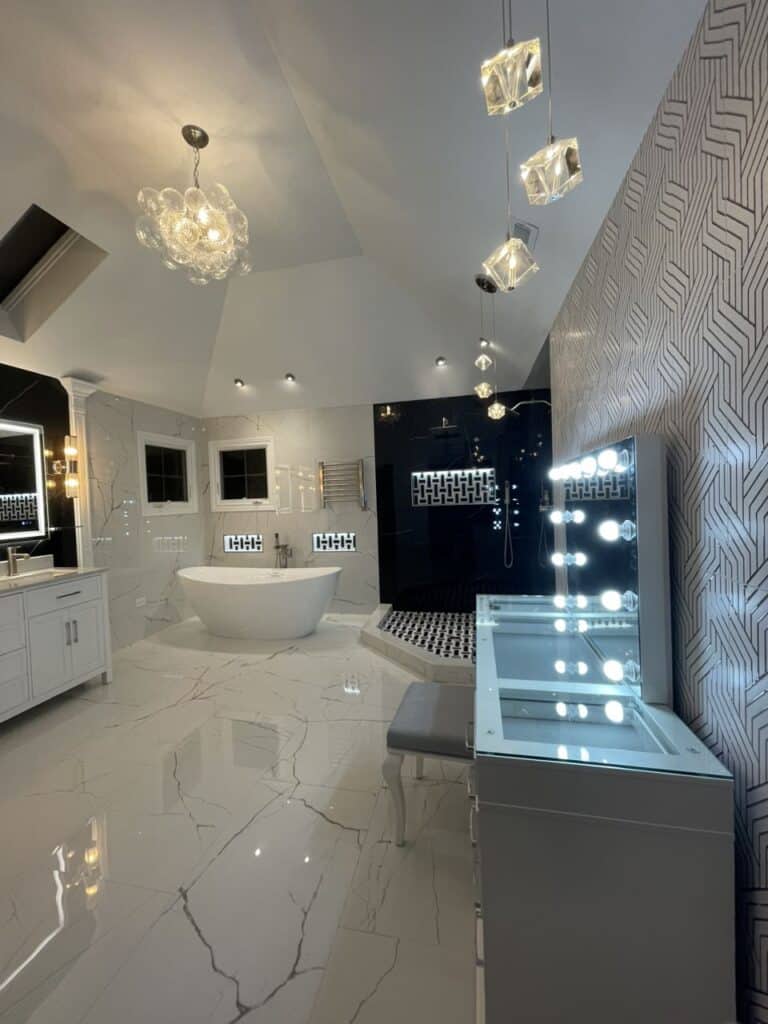 Modern luxury bathroom with freestanding tub, elegant lighting, and stylish decor.