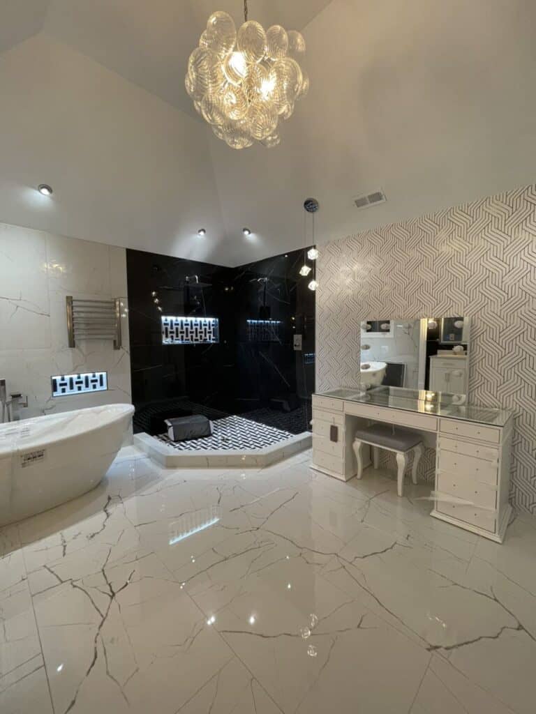 Modern bathroom with bathtub, shower, and vanity in a luxurious setting.
